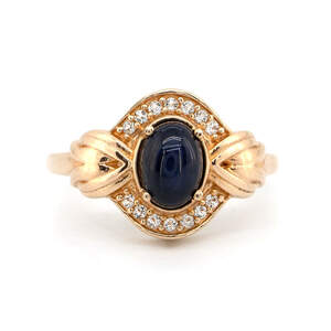 Срібна каблучка 925 проби в позолоті 750 проби 3,41 гр. зі шрі-ланкійським зірчастим сапфіром класу AAA та топазами зі США 1,55 карат