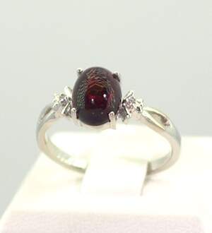Серебряное кольцо 925 пробы 2,43 гр. с черным эфиопским Опалом класса АААА и топазами из США 1,2 карат