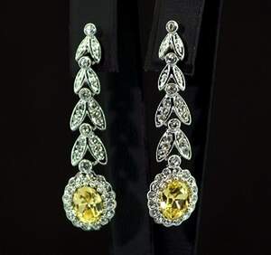 Комплект у покритті родієм з жовтими та білими фіанітами: кольє, браслет, сережки 2 пари