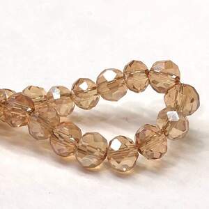 Бусины хрустальные рондель 4х3мм, нить-135 шт, ореховый прозрачный