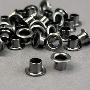 Люверс D-4мм нержавейка с пластиковым кольцом-темный никель (100шт) (матр.00253) Люверс D-4мм нержавейка с пластиковым кольцом-темный никель (100шт) (матр.00253)