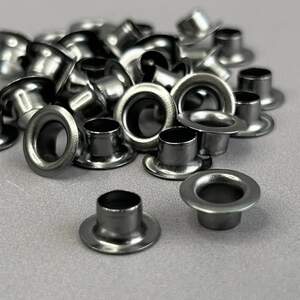 Люверс D-6мм нерж. с пласт. кольцом-темный никель (100шт) (матр.00255) Люверс D-6мм нерж. с пласт. кольцом-темный никель (100шт) (матр.00255)