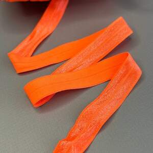 Оранж неон - Трикотажная (эластичная) окантовочная бейка с блеском 1,5см х 1м