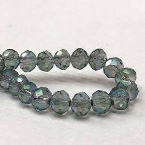 Бусины хрустальные рондель 4х3мм, нить-135 шт, дымчатый прозрачный с покрытием АВ Бусины хрустальные рондель 4х3мм, нить-135 шт, дымчатый прозрачный с покрытием АВ