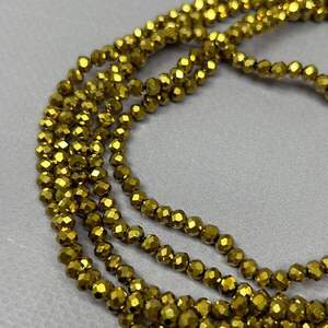 Бусины хрустальные рондель 4х3мм, нить-135 шт, золотое напыление Бусины хрустальные рондель 4х3мм, нить-135 шт, золотое напыление